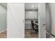 A dedicated office space adjacent to the kitchen, complete with custom built-ins and a sliding barn door at 1262 High Point Trl, Elizabeth, CO 80107