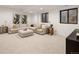 Spacious finished basement with plush carpeting, recessed lighting, and a comfortable sectional sofa at 4301 Osceola St, Denver, CO 80212
