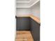 Finished basement featuring modern cabinets and hardwood flooring at 4301 Osceola St, Denver, CO 80212