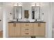Bathroom featuring dual sinks, square mirrors, and modern lighting fixtures at 4301 Osceola St, Denver, CO 80212