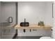 Modern bathroom with a floating wood vanity, a black vessel sink, and a walk-in shower with stylish tile at 4301 Osceola St, Denver, CO 80212