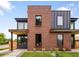 Modern two-story home showcases a striking brick facade and dark metal accents at 4301 Osceola St, Denver, CO 80212