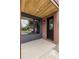 Charming covered porch with brick accents and modern black door at 4301 at 4301 Osceola St, Denver, CO 80212