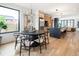 Open floor plan with dining area and kitchen featuring a large island at 4301 Osceola St, Denver, CO 80212