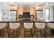 Gourmet kitchen with light wood cabinets, stainless steel appliances, and modern island at 4301 Osceola St, Denver, CO 80212
