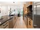 Modern kitchen design with dark countertops, stainless appliances, and ample space at 4301 Osceola St, Denver, CO 80212