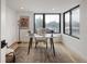 Bright home office featuring modern lighting, a round table, and large windows offering plenty of natural light at 4301 Osceola St, Denver, CO 80212
