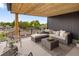 Comfortable rooftop deck with stylish furniture, a wooden ceiling, and views of the surrounding neighborhood at 4301 Osceola St, Denver, CO 80212