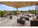 Inviting rooftop deck featuring stylish patio furniture, a wooden ceiling, and neighborhood views at 4301 Osceola St, Denver, CO 80212
