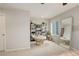 Bright bedroom with a papasan chair, shelving, and natural light at 16102 E 47Th Pl, Denver, CO 80239