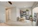 Spacious bedroom with a papasan chair, shelving, and natural light at 16102 E 47Th Pl, Denver, CO 80239