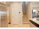 Inviting entryway featuring a staircase and stainless steel refrigerator at 16102 E 47Th Pl, Denver, CO 80239