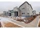 Attractive townhome community featuring contemporary architectural designs and manicured landscaping with snowy front yards at 16102 E 47Th Pl, Denver, CO 80239