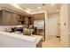 Well-lit kitchen featuring stainless steel appliances, dark wood cabinetry, and bright countertops at 16102 E 47Th Pl, Denver, CO 80239