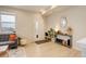 Cozy living room boasting light wood floors, comfy gray sofa, and bright natural light from a window at 16102 E 47Th Pl, Denver, CO 80239