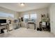 Bright home office featuring dual desks and ample natural light from multiple windows at 16102 E 47Th Pl, Denver, CO 80239