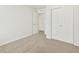 Bedroom with plush neutral carpet and large double door closet at 6532 N Malaya St, Aurora, CO 80019