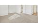 This spacious bedroom features a neutral color palette, soft carpet, and a bright open entrance at 6532 N Malaya St, Aurora, CO 80019