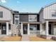 Charming townhome boasts stone accents, white trim, and a welcoming front porch at 6532 N Malaya St, Aurora, CO 80019