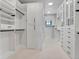Large walk-in closet provides ample storage with custom shelves and drawers at 2690 Fox View Trl, Franktown, CO 80116