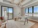 Bright home office has large windows and sliding doors with access to an outdoor balcony at 2690 Fox View Trl, Franktown, CO 80116