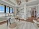 Well-lit home office with shelving, modern light fixture, and views at 2690 Fox View Trl, Franktown, CO 80116