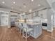 Spacious kitchen features stainless steel appliances, modern light fixtures, and a large center island at 2690 Fox View Trl, Franktown, CO 80116