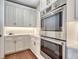 Modern kitchen boasts stainless steel appliances, custom cabinets, and a light, neutral color palette at 2690 Fox View Trl, Franktown, CO 80116
