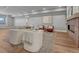 Spacious living area with modern decor, a cozy fireplace, and comfortable seating arrangements at 2690 Fox View Trl, Franktown, CO 80116