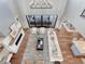 Aerial view of open-concept living room with modern fireplace and furniture at 2690 Fox View Trl, Franktown, CO 80116