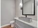 Chic powder room featuring modern sink, elegant textured wall and sleek fixtures at 2690 Fox View Trl, Franktown, CO 80116