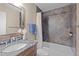 Stylish bathroom with granite counters and tiled shower and bath at 100 S Park Ave # E321, Breckenridge, CO 80424
