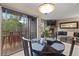 Inviting dining area flows to balcony and overlooks the spacious living room with its stone fireplace at 100 S Park Ave # E321, Breckenridge, CO 80424