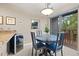Open dining area with modern light fixture conveniently placed next to the kitchen and outdoor balcony at 100 S Park Ave # E321, Breckenridge, CO 80424