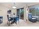Bright dining area with stylish lighting and chairs has easy access to patio balcony at 100 S Park Ave # E321, Breckenridge, CO 80424