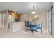 Bright dining area with stylish pendant lighting is conveniently located adjacent to the kitchen and patio doors at 100 S Park Ave # E321, Breckenridge, CO 80424