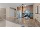 Modern kitchen with granite countertops, stainless steel appliances, and tiled backsplash at 100 S Park Ave # E321, Breckenridge, CO 80424