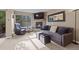 Comfortable living room featuring a stone fireplace, a flat-screen TV, and views of nature through a large window at 100 S Park Ave # E321, Breckenridge, CO 80424