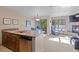 Well-lit living space with access to a kitchen bar, dining area and fireplace entertainment center at 100 S Park Ave # E321, Breckenridge, CO 80424
