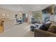 Inviting living room with a stone fireplace and flat screen TV adjacent to dining area and balcony at 100 S Park Ave # E321, Breckenridge, CO 80424