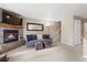 Welcoming living room with a stone fireplace, a comfortable sofa, and a staircase leading to the upper level at 100 S Park Ave # E321, Breckenridge, CO 80424