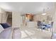 Open concept living area showcases a kitchen bar, dining space and cozy seating area with stairs to upper level at 100 S Park Ave # E321, Breckenridge, CO 80424