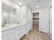 Well-lit bathroom with double vanity, walk-in shower, and modern fixtures at 9992 Racine St, Commerce City, CO 80022