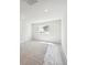 Bright bedroom featuring new carpet, recessed lighting and a large window at 9992 Racine St, Commerce City, CO 80022
