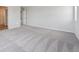 Light-filled bedroom with plush carpeting and ample space for furniture at 9992 Racine St, Commerce City, CO 80022