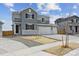 Charming two-story home with a spacious three car garage and well-maintained front yard at 9992 Racine St, Commerce City, CO 80022