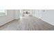 Open concept living room featuring luxury vinyl flooring, plenty of natural light, and open floorplan at 9992 Racine St, Commerce City, CO 80022