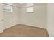 Neutral bedroom with carpet flooring and natural light offers a simple and inviting space at 6800 Fern Dr, Denver, CO 80221