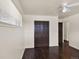 Cozy bedroom with hardwood floors, a ceiling fan, and a spacious closet for ample storage at 6800 Fern Dr, Denver, CO 80221