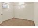Neutral bedroom with carpet flooring and natural light offers a simple and inviting space at 6800 Fern Dr, Denver, CO 80221